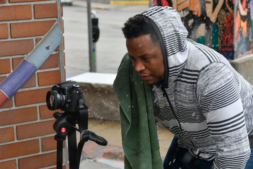 Sean Mearidy sets up his camera